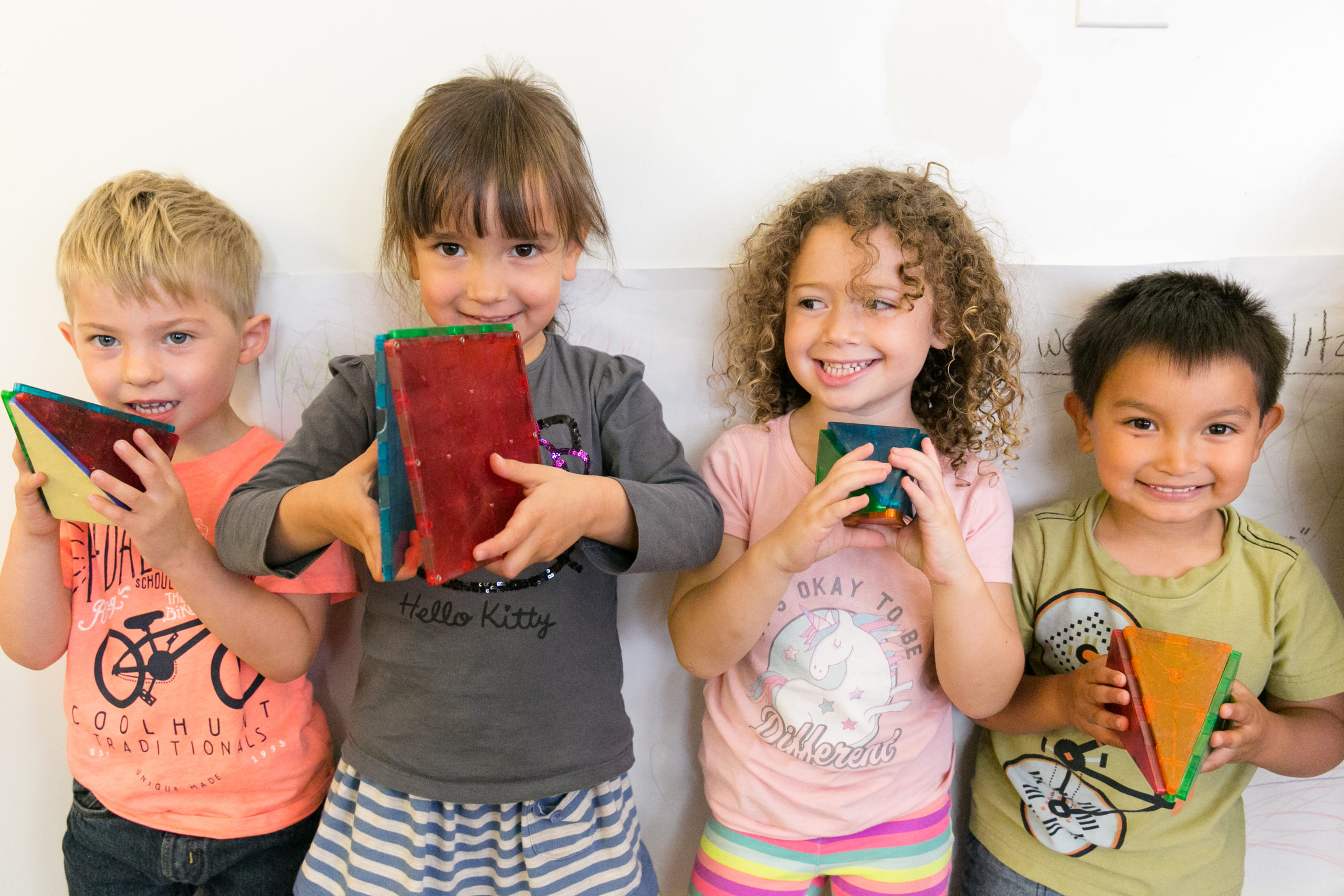 Kids holding toys