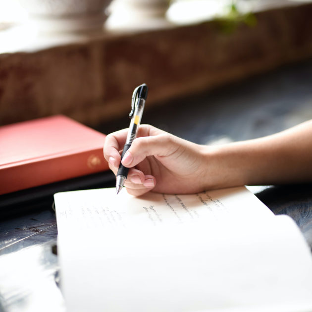 woman writing in journal