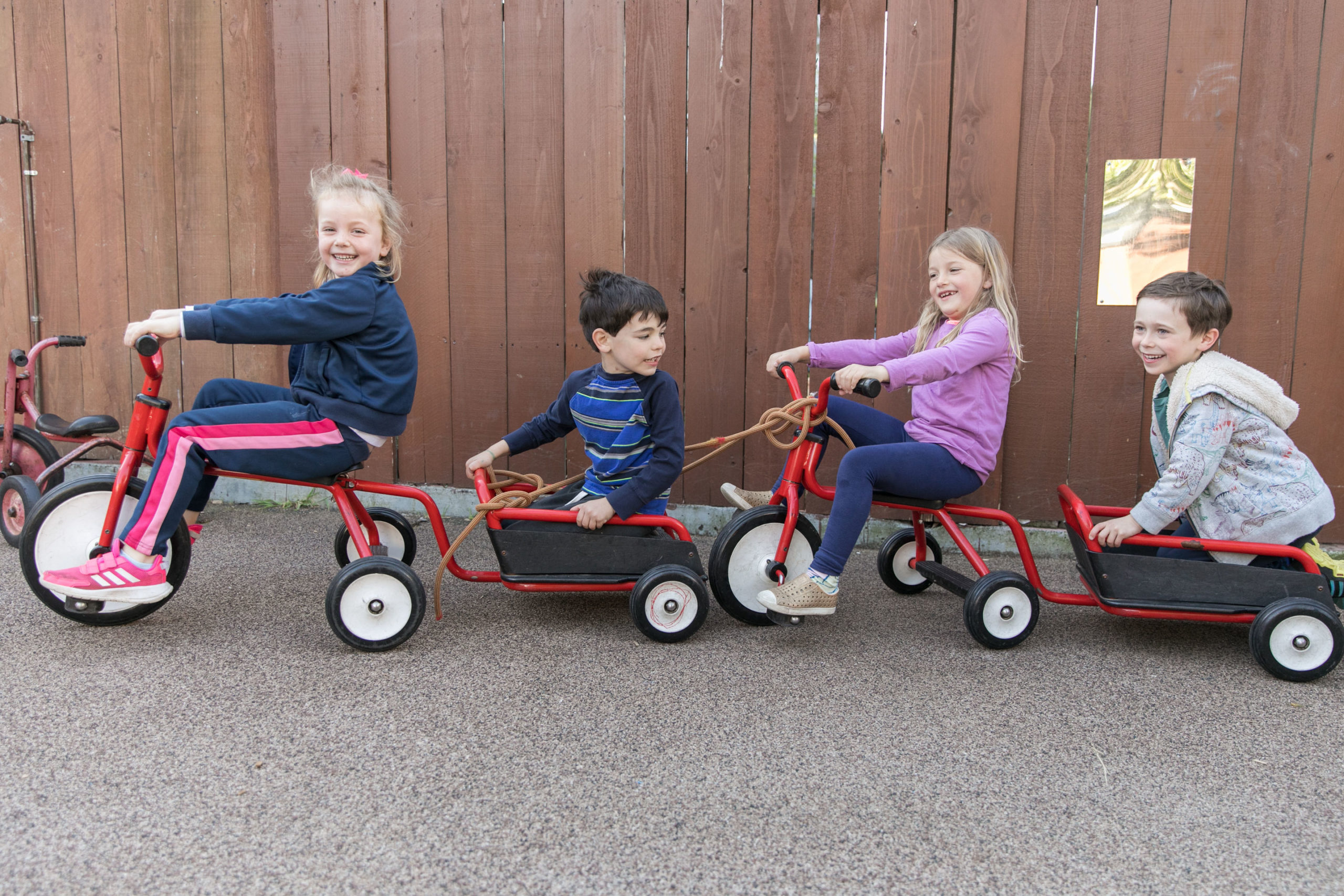 Children riding a bicycle train