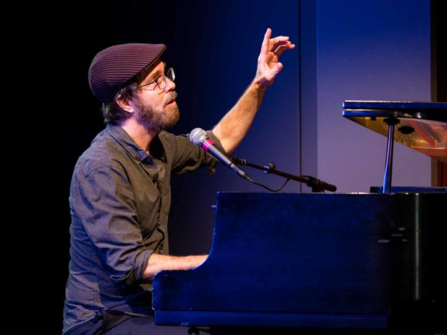 Ben Folds performs on piano