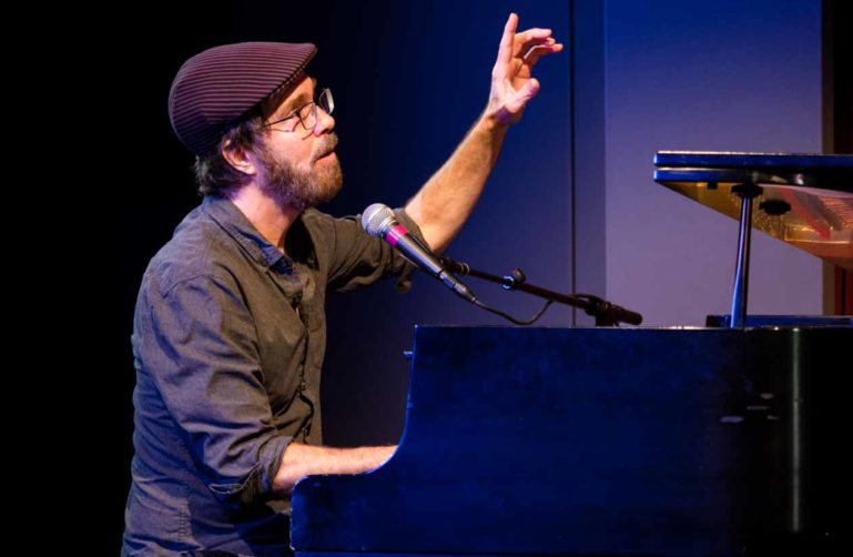 Ben Folds performs on piano