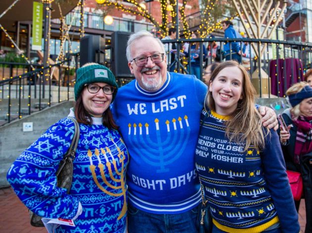 Three people pose for Hanukkah group photo