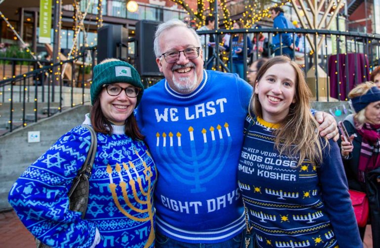 Three people pose for Hanukkah group photo