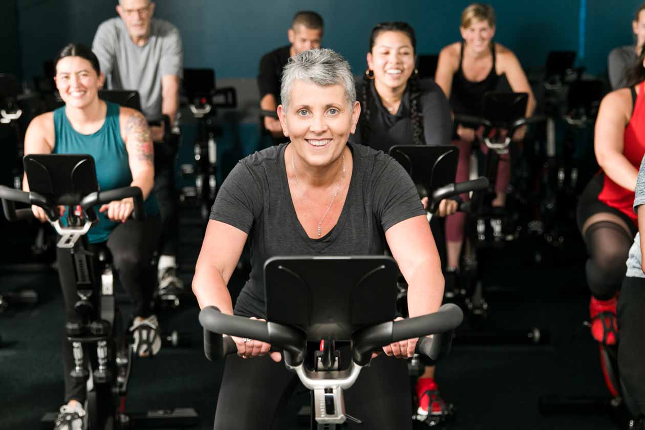 Smiling spin class attendees