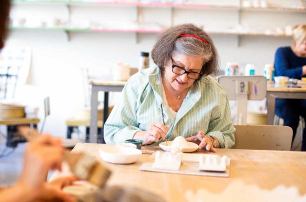 Woman participates in adult ceramics class