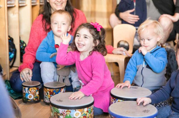 Preschool class uses children's drums