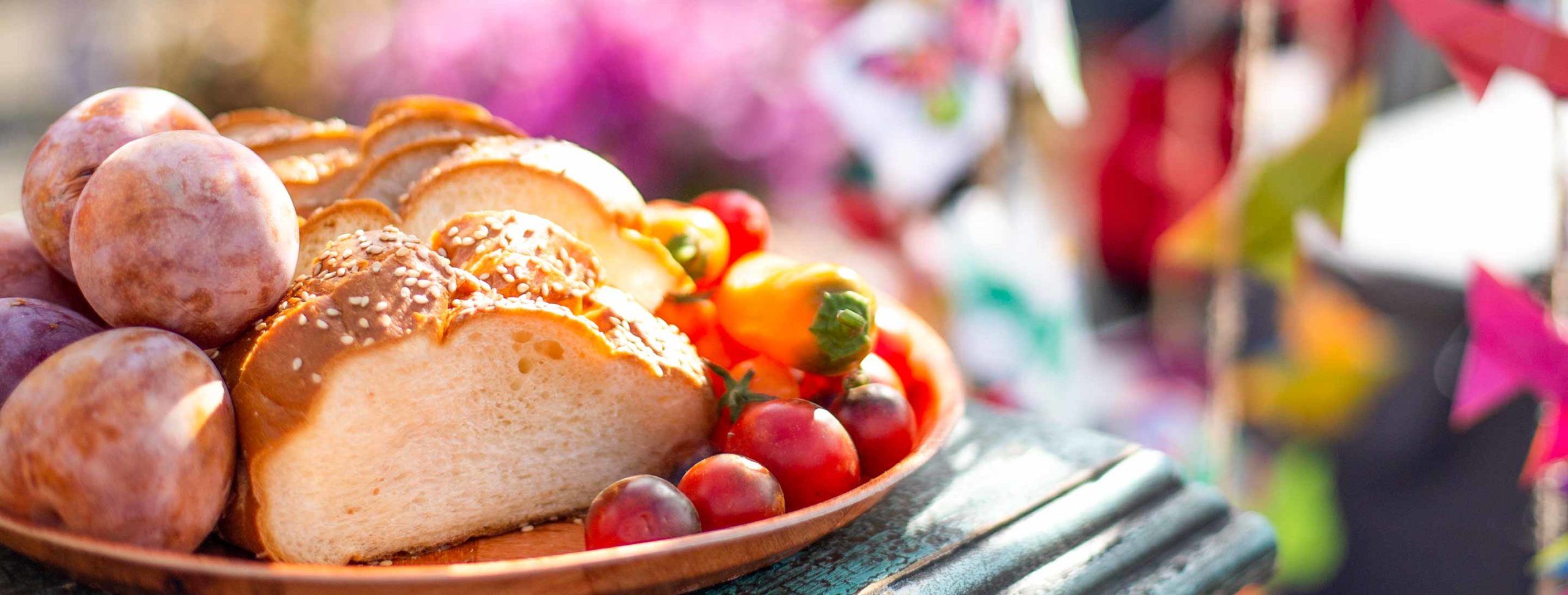 Colorful plate of food with festival in background