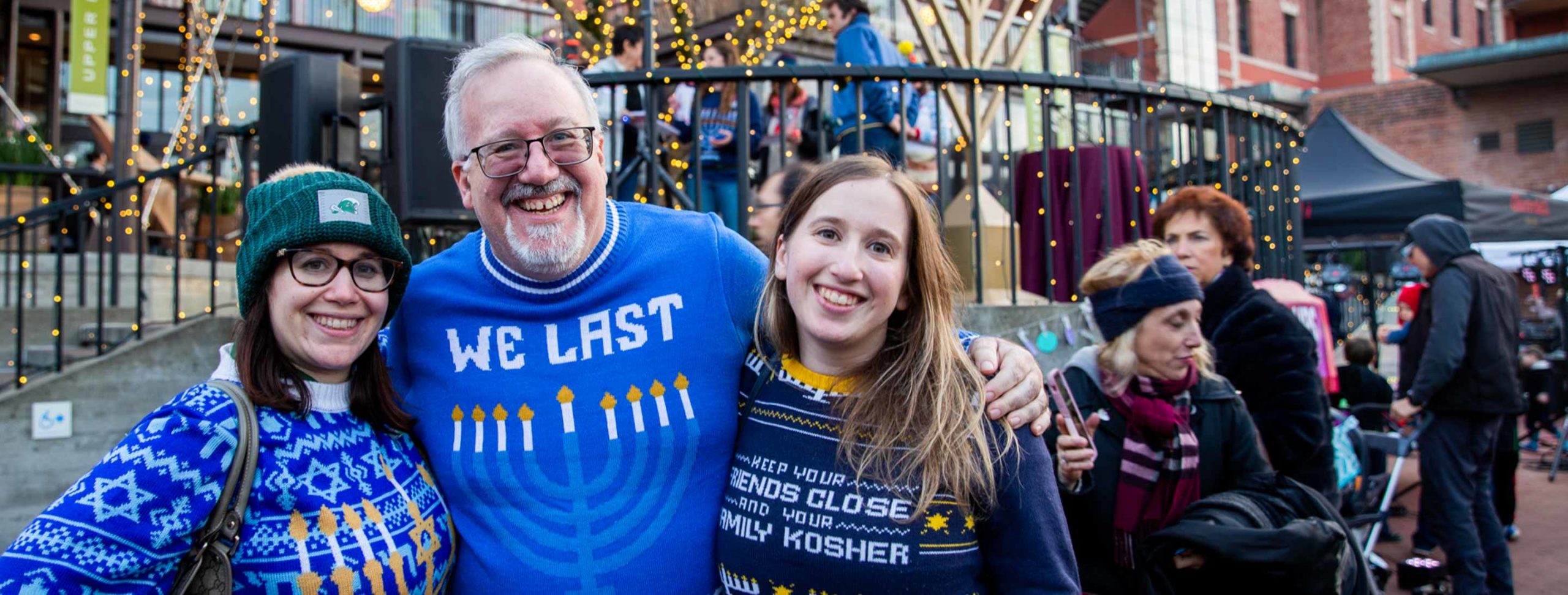 Three people pose for Hanukkah group photo