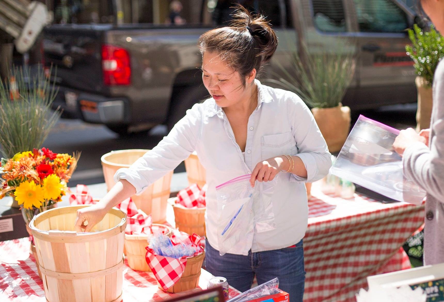 Woman reaching into a basket