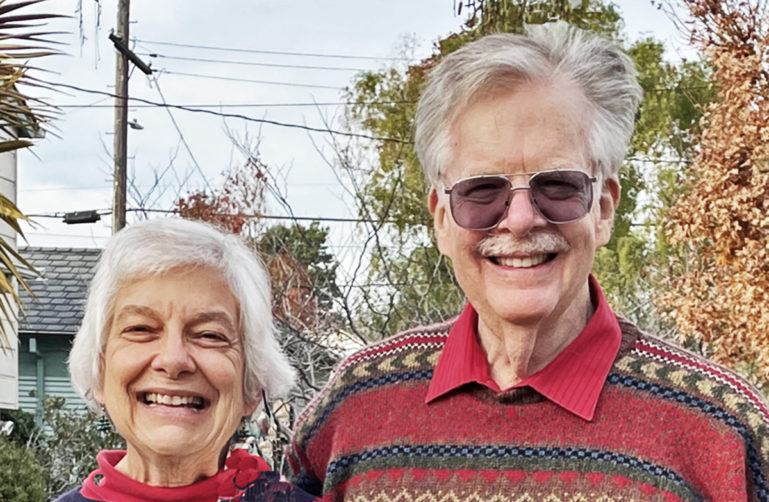 Picture of Jim Rebhan and Barbara Hollinger smiling side by side.