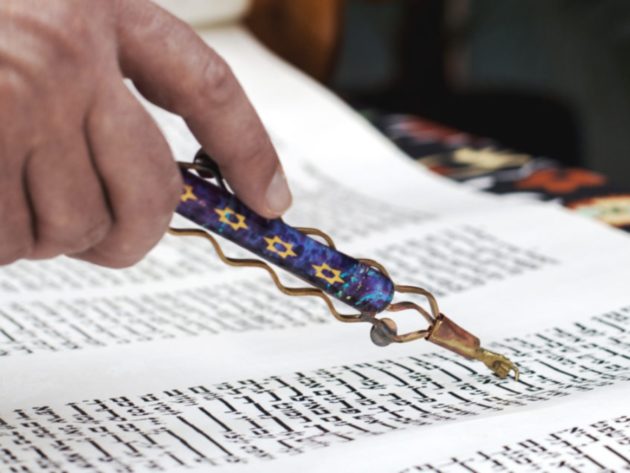 Person reading Torah