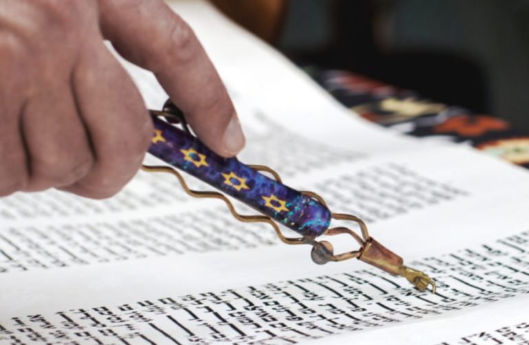 Person reading Torah