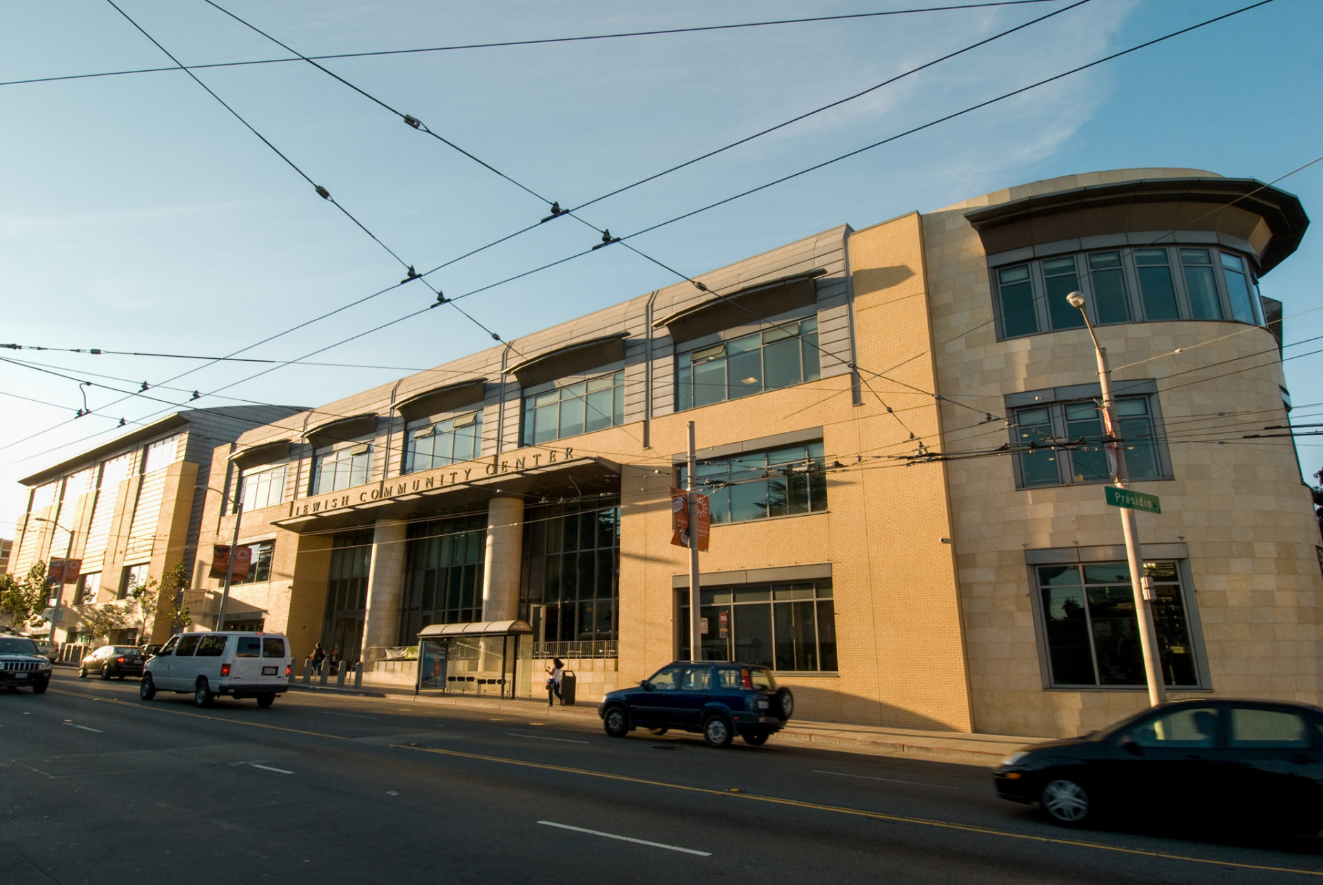 picture of the JCCSF from the outside. It is a large, 3 story building that is beige with many windows