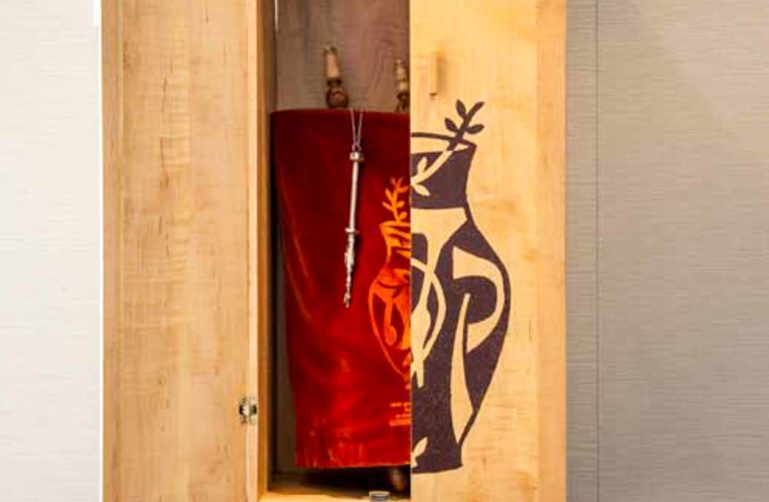 Closet door open to reveal red cloth