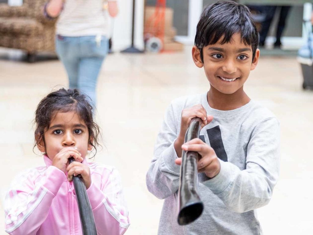 Young children play shofars at JCCSF gathering