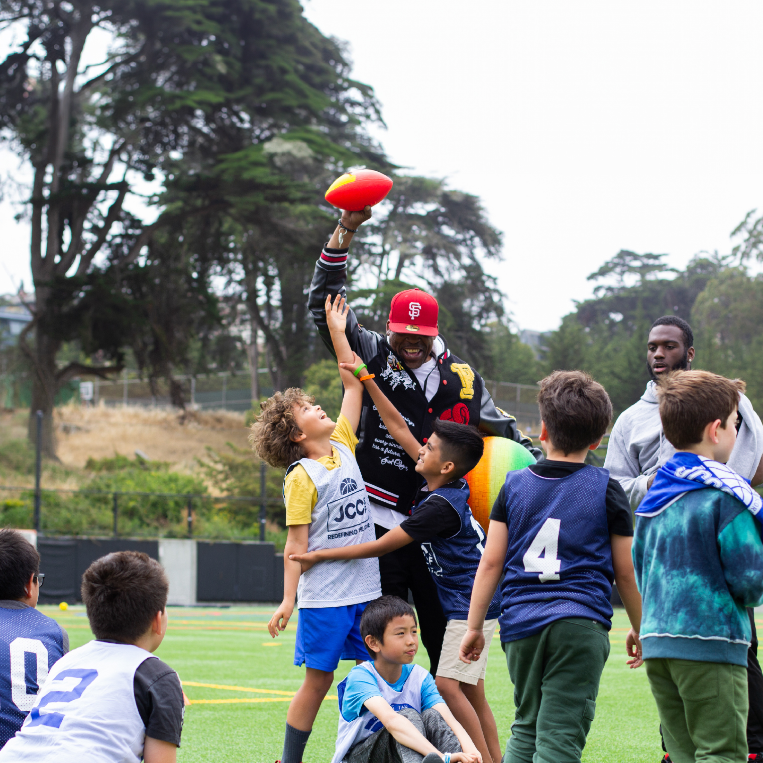 Campers having fun playing flag football.
